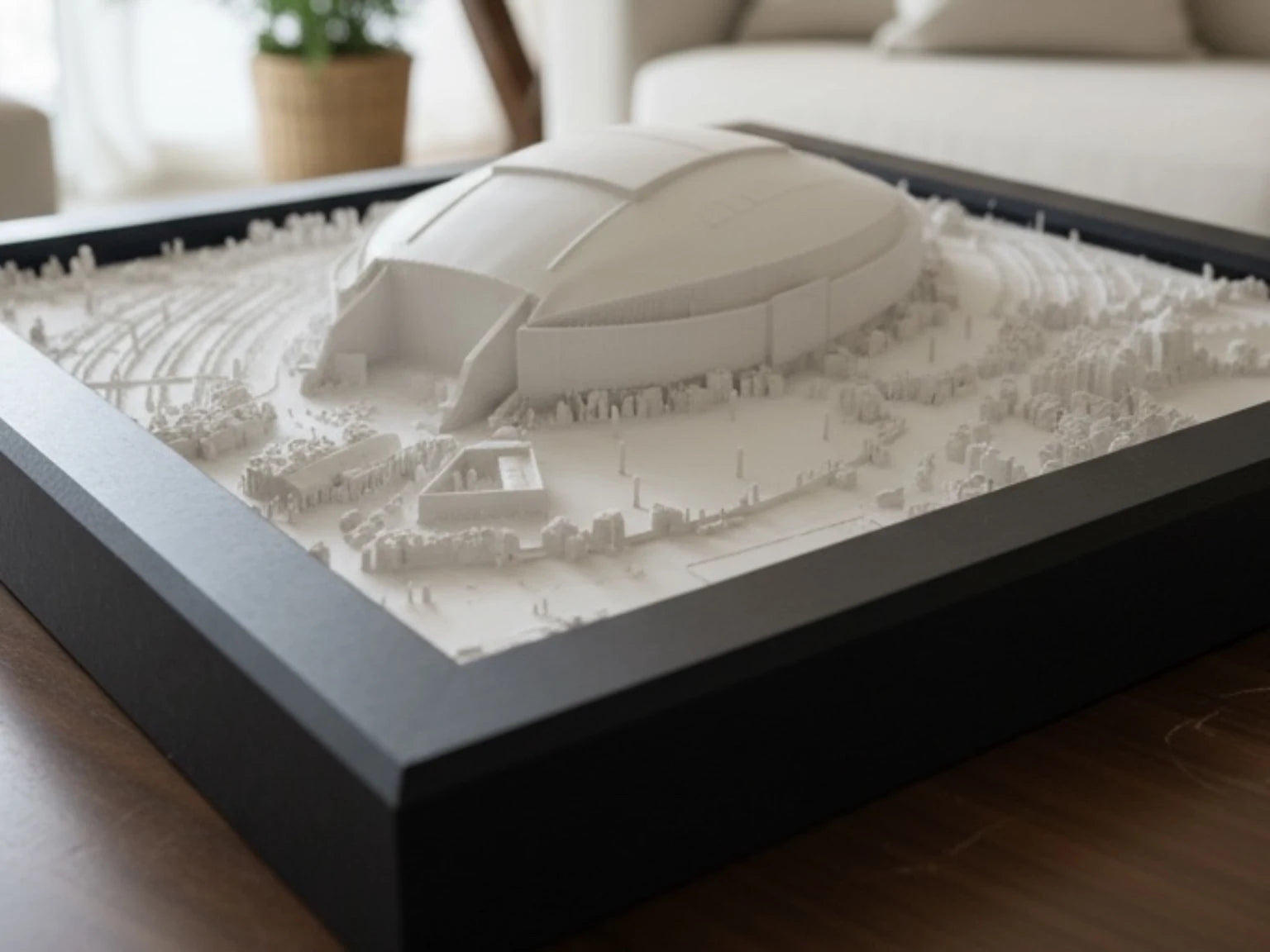 White stadium model in a black display frame